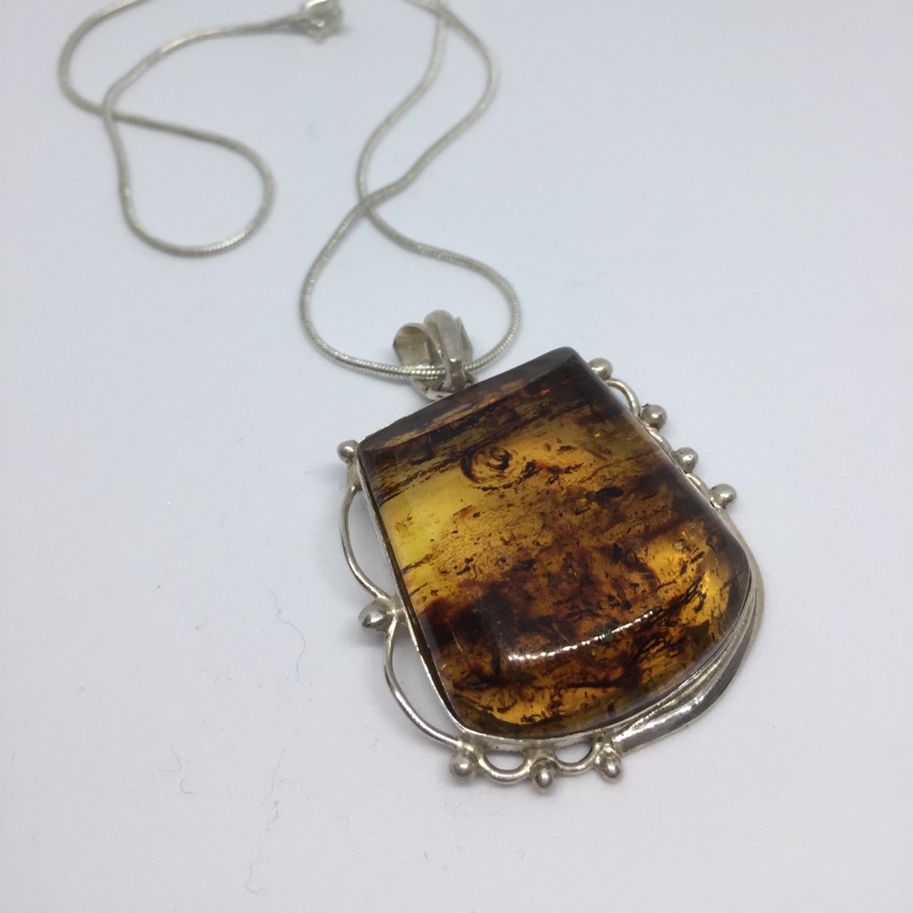 Amazing amber pendant with sterling silver